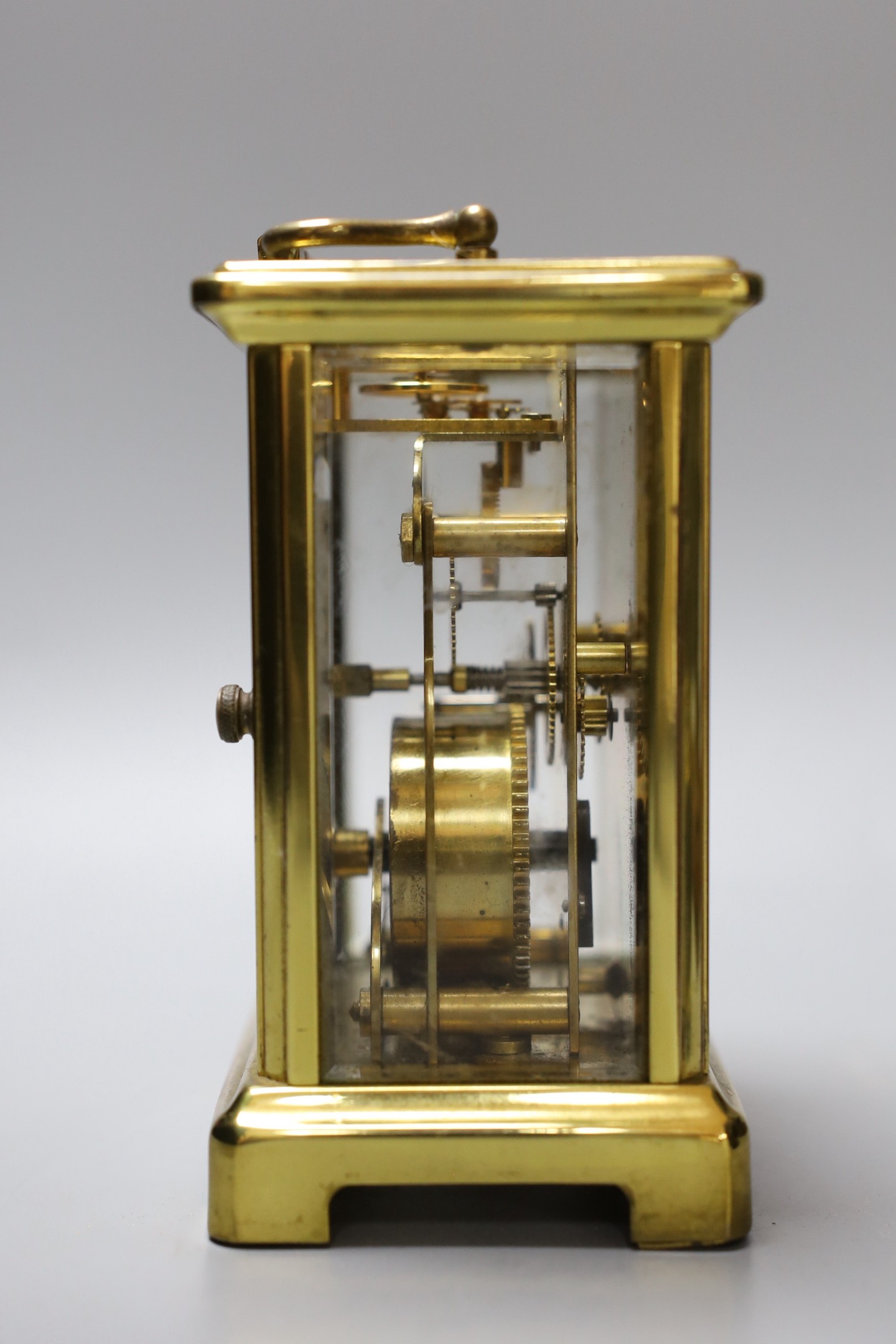 A five draw telescope, a pair of cased binoculars, postal scales and a brass timepiece, telescope drawn 69 cms long
